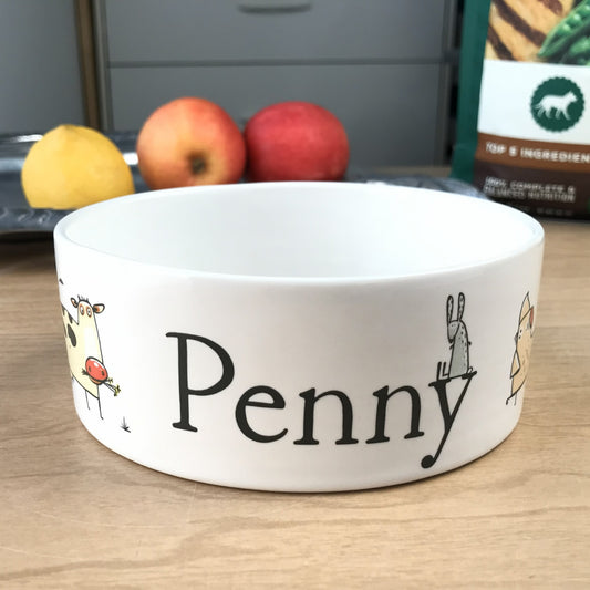 White personalized dog bowl with funny cartoon farm animals.